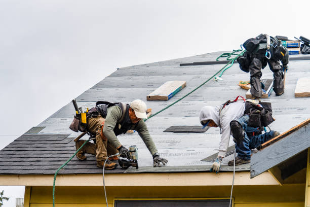 Professional Gutter Installation technician working in Raymond, MS